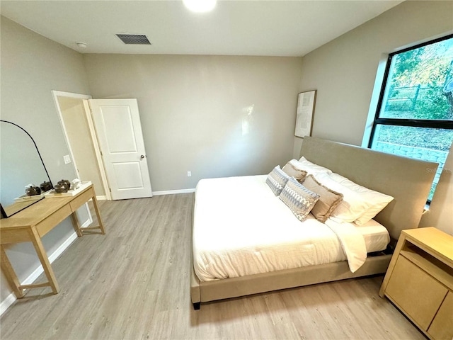 bedroom featuring light hardwood / wood-style floors