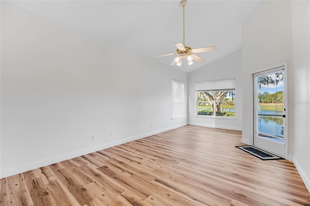 spare room featuring ceiling fan, light hardwood / wood-style floors, and high vaulted ceiling