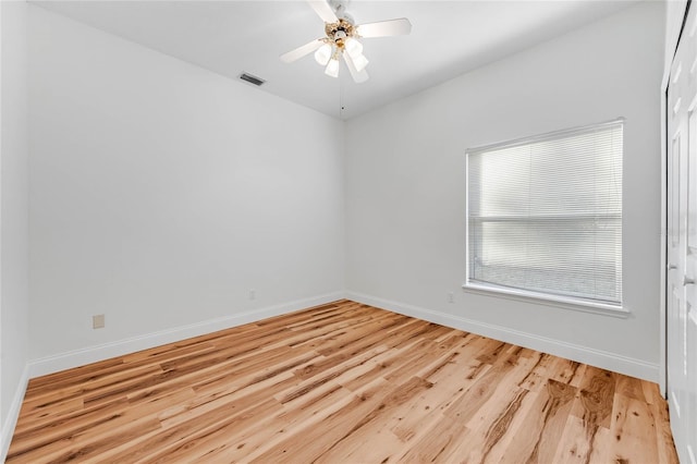 unfurnished room with ceiling fan and light wood-type flooring