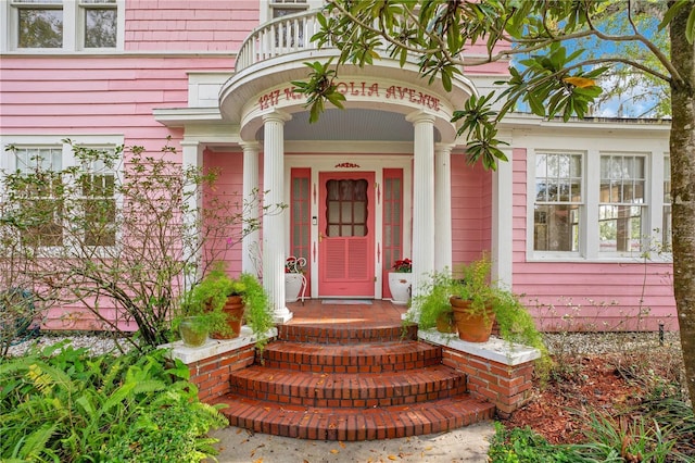 entrance to property with a balcony