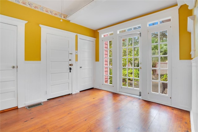 foyer with light hardwood / wood-style floors