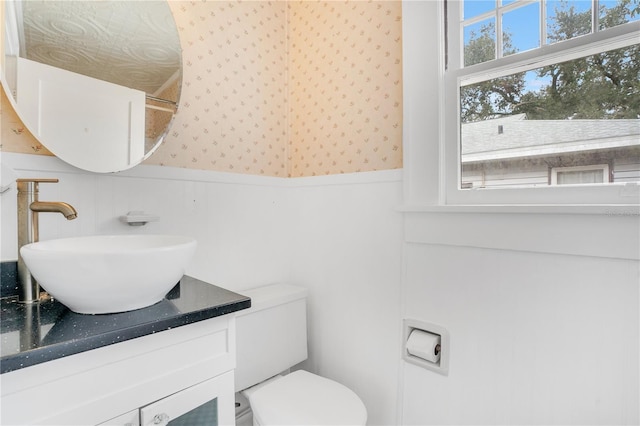 bathroom featuring vanity and toilet