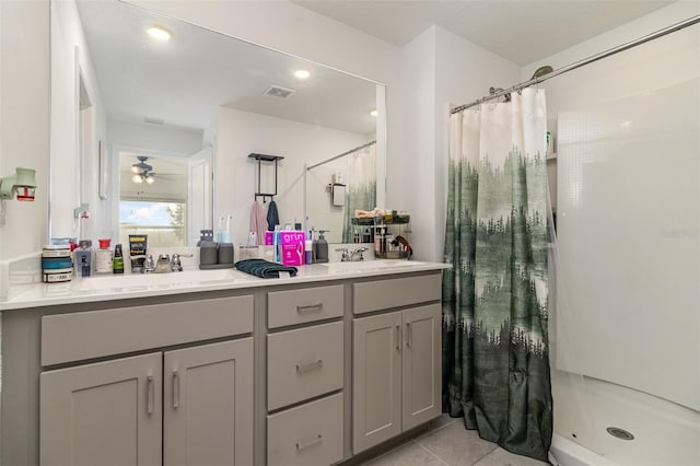 bathroom with tile patterned floors, ceiling fan, vanity, and a shower with shower curtain