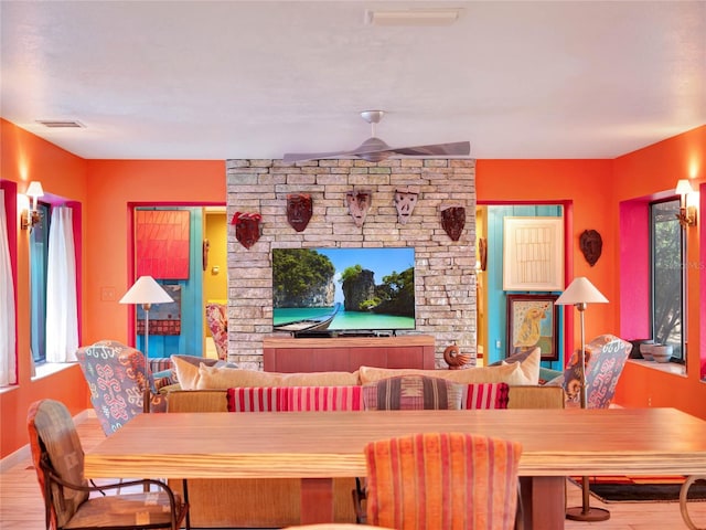 dining area featuring ceiling fan and light hardwood / wood-style floors