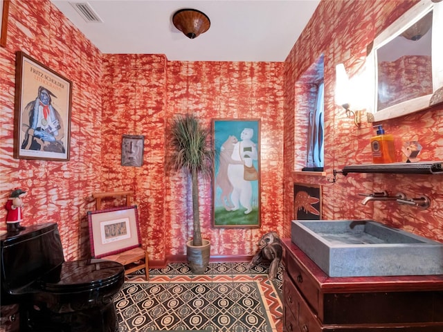 sitting room with tile patterned floors and sink