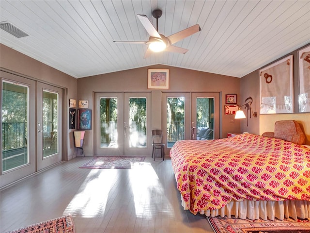 bedroom with french doors, access to exterior, and vaulted ceiling