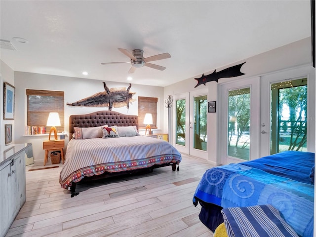 bedroom featuring light hardwood / wood-style flooring, access to outside, french doors, and ceiling fan