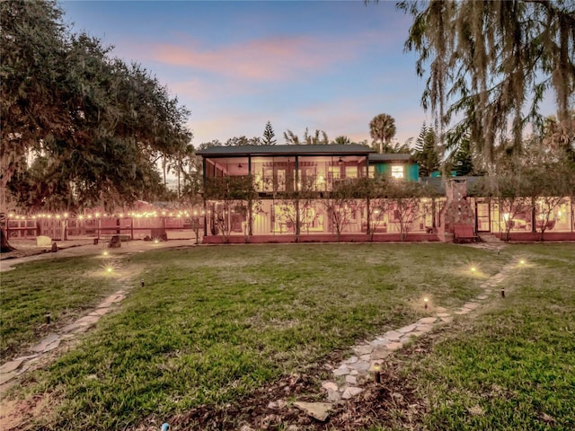 view of yard at dusk