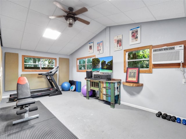 workout room featuring vaulted ceiling, a paneled ceiling, a wall mounted air conditioner, and ceiling fan