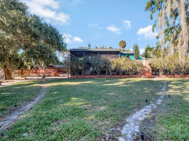 view of yard with a sunroom