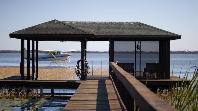 dock area featuring a water view