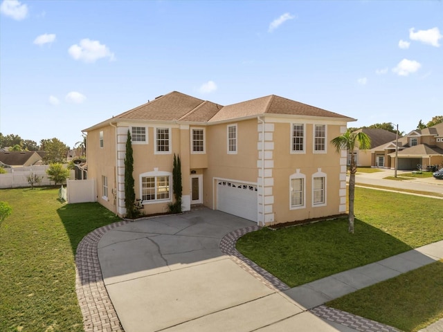 view of front of home with a front lawn and a garage