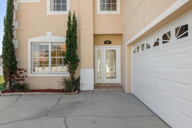 entrance to property featuring a garage