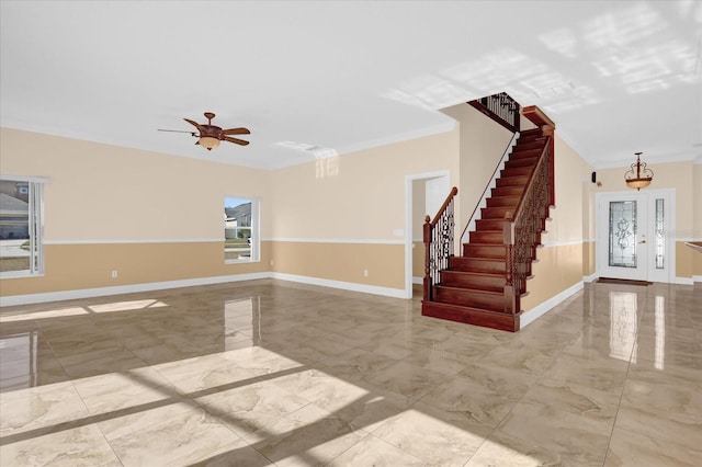 unfurnished room featuring ceiling fan and crown molding