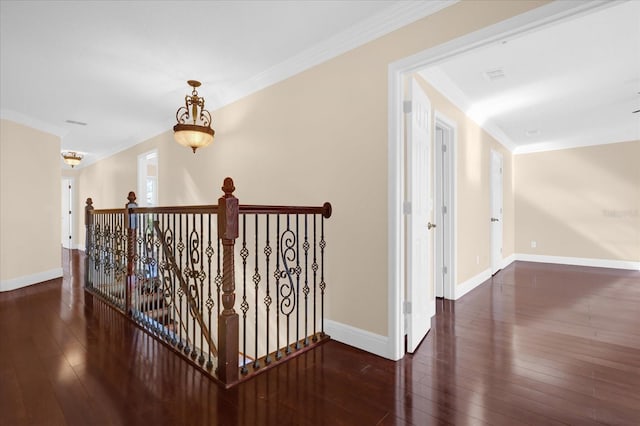 corridor featuring dark hardwood / wood-style floors and ornamental molding