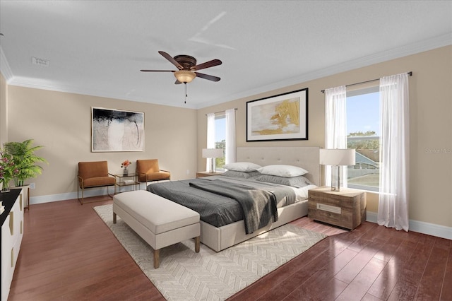 bedroom featuring ceiling fan, hardwood / wood-style floors, and ornamental molding