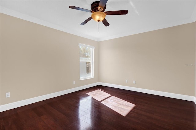 unfurnished room with ceiling fan, crown molding, and dark wood-type flooring