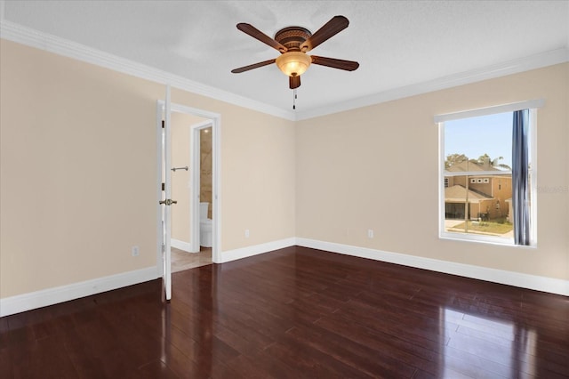 empty room featuring dark hardwood / wood-style flooring, crown molding, plenty of natural light, and ceiling fan