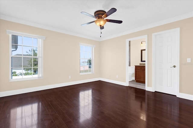 interior space featuring dark hardwood / wood-style flooring, plenty of natural light, and ornamental molding