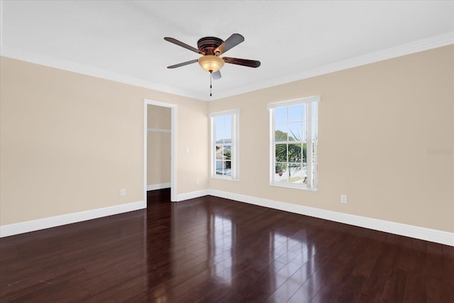 unfurnished room featuring ceiling fan, dark hardwood / wood-style flooring, and ornamental molding