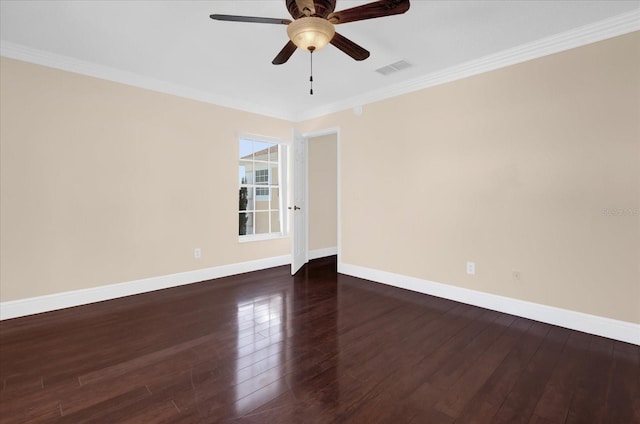 spare room featuring ceiling fan, dark hardwood / wood-style flooring, and crown molding