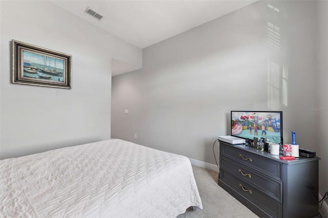 bedroom with light colored carpet