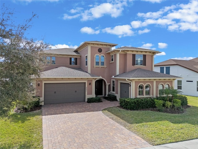 mediterranean / spanish home with a front yard