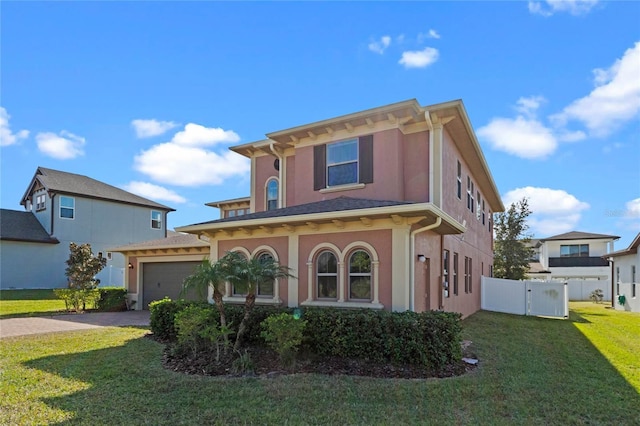 view of front of house featuring a garage and a front yard