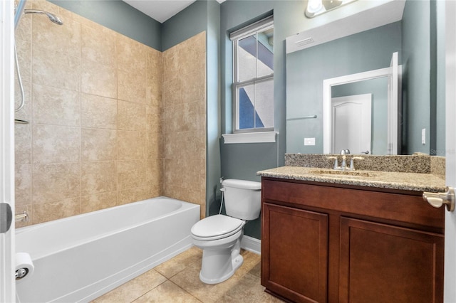 full bathroom with tiled shower / bath combo, vanity, toilet, and tile patterned flooring