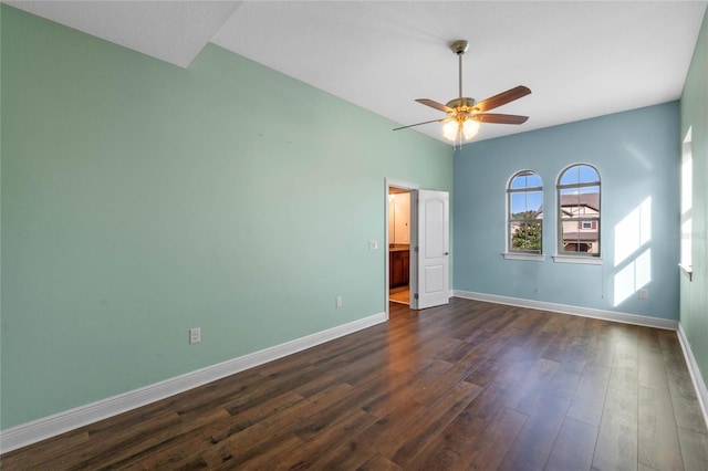 spare room featuring ceiling fan and dark hardwood / wood-style floors