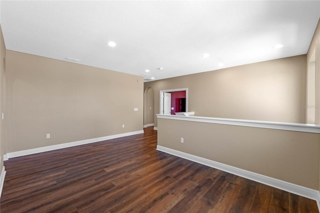 spare room featuring dark hardwood / wood-style floors