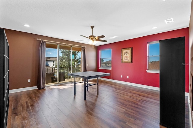 recreation room featuring ceiling fan and dark wood-type flooring