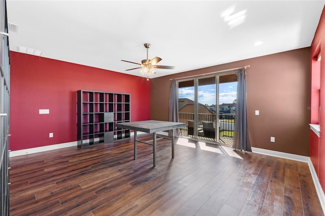 rec room with ceiling fan and dark wood-type flooring