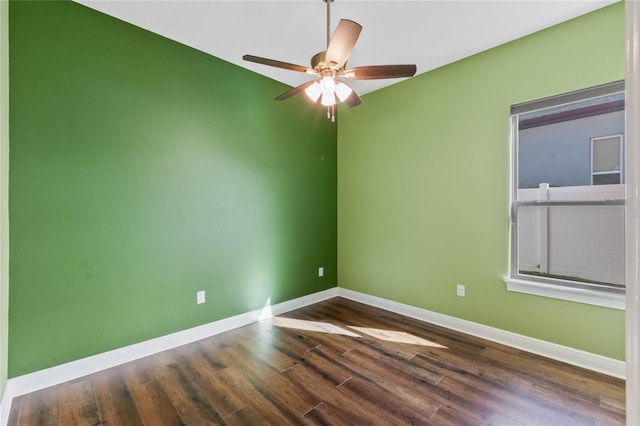 unfurnished room with ceiling fan and dark wood-type flooring