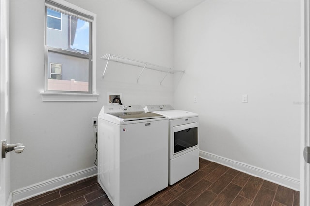 clothes washing area with separate washer and dryer