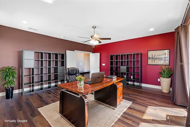 home office with ceiling fan and dark hardwood / wood-style floors