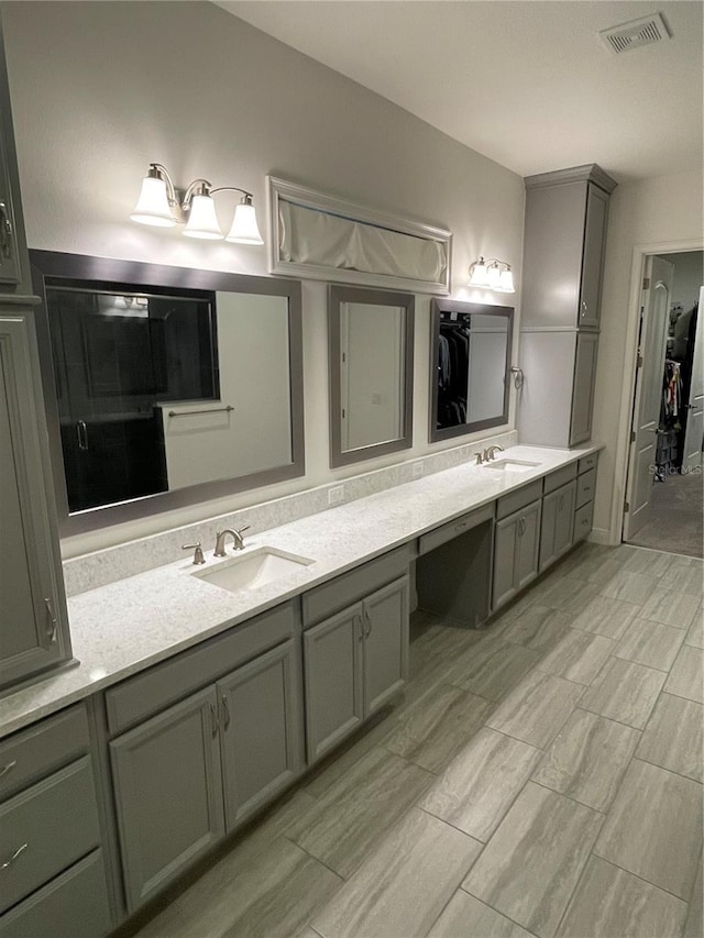 bathroom with vanity and an enclosed shower