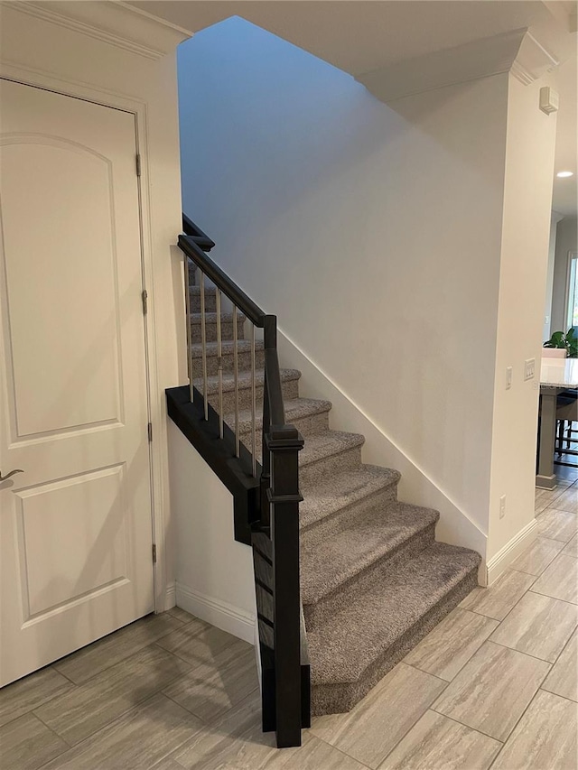 stairs featuring ornamental molding