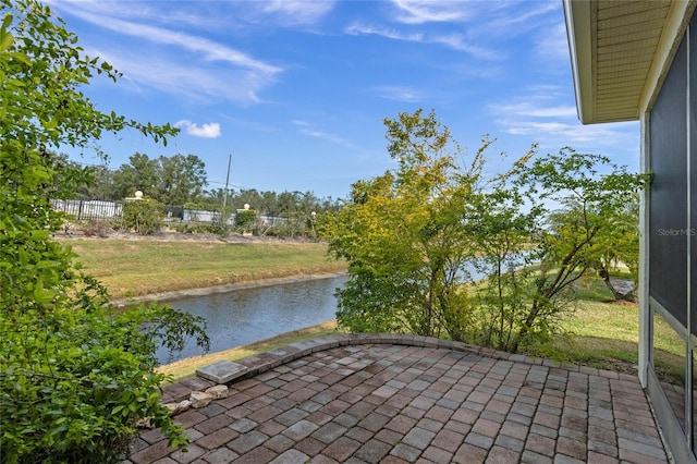 view of patio featuring a water view