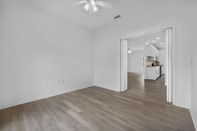4112 Aberdeen Ln, Lake Wales, FL 33859 - empty room featuring ceiling fan, wood finished floors, and recessed lighting