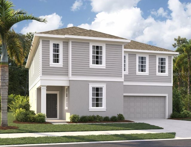 view of front of home featuring a garage and a front yard