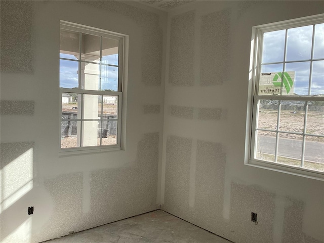 spare room featuring plenty of natural light