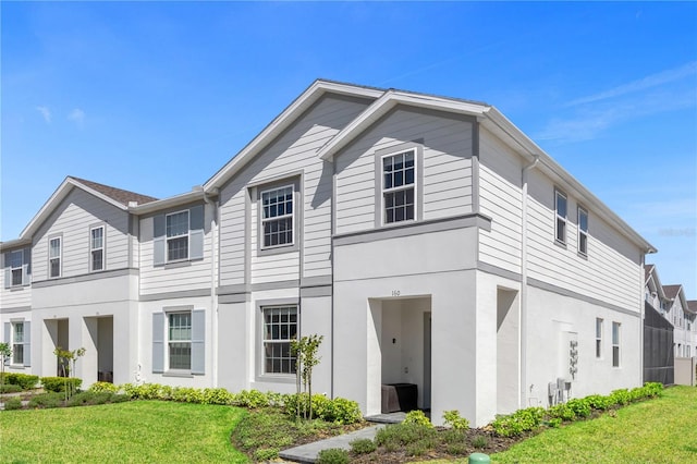 view of front of property with a front lawn