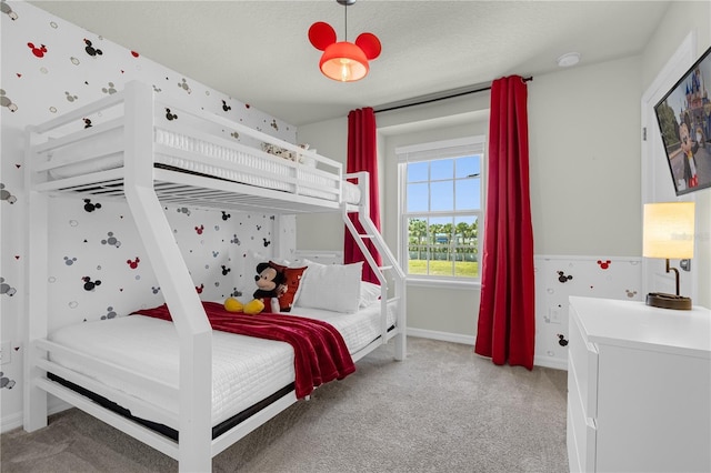 carpeted bedroom with a textured ceiling