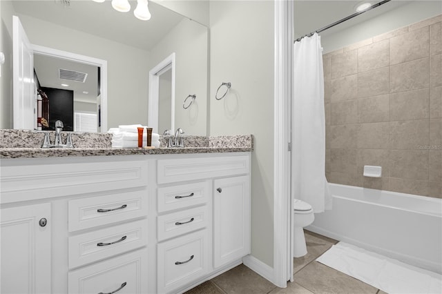 full bathroom featuring toilet, shower / tub combo, vanity, and tile patterned floors