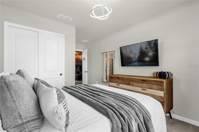 carpeted bedroom with a closet