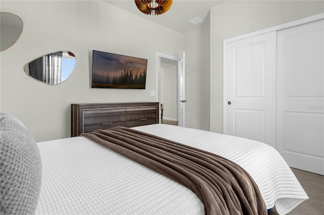 carpeted bedroom featuring a closet