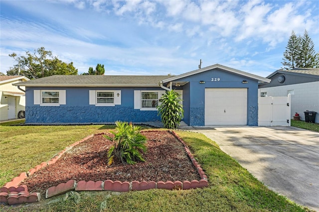 ranch-style house with a garage and a front yard