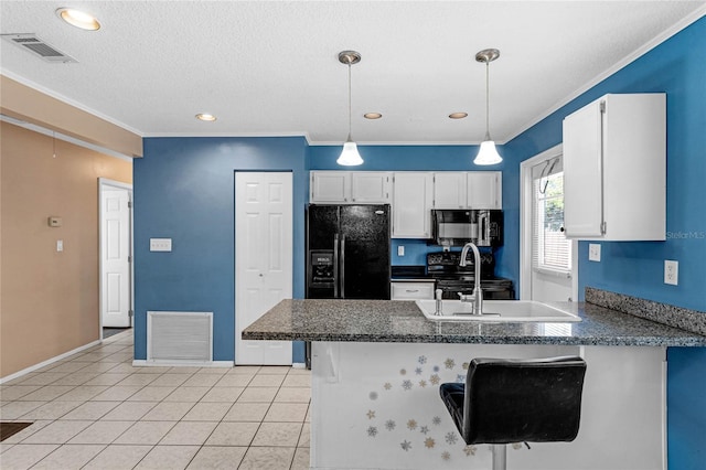 kitchen featuring black appliances, white cabinetry, kitchen peninsula, and a breakfast bar area