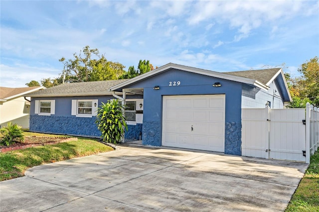 ranch-style house featuring a garage